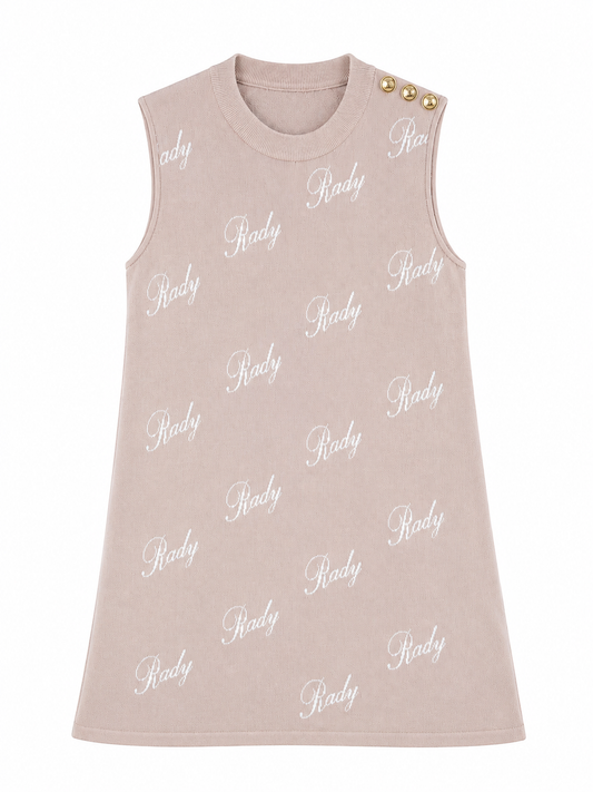 A sleeveless baby dress in a dusty rose pink color, featuring an all-over white script 'Ridgy' logo print and three gold buttons on the shoulder, shown against a plain white background.